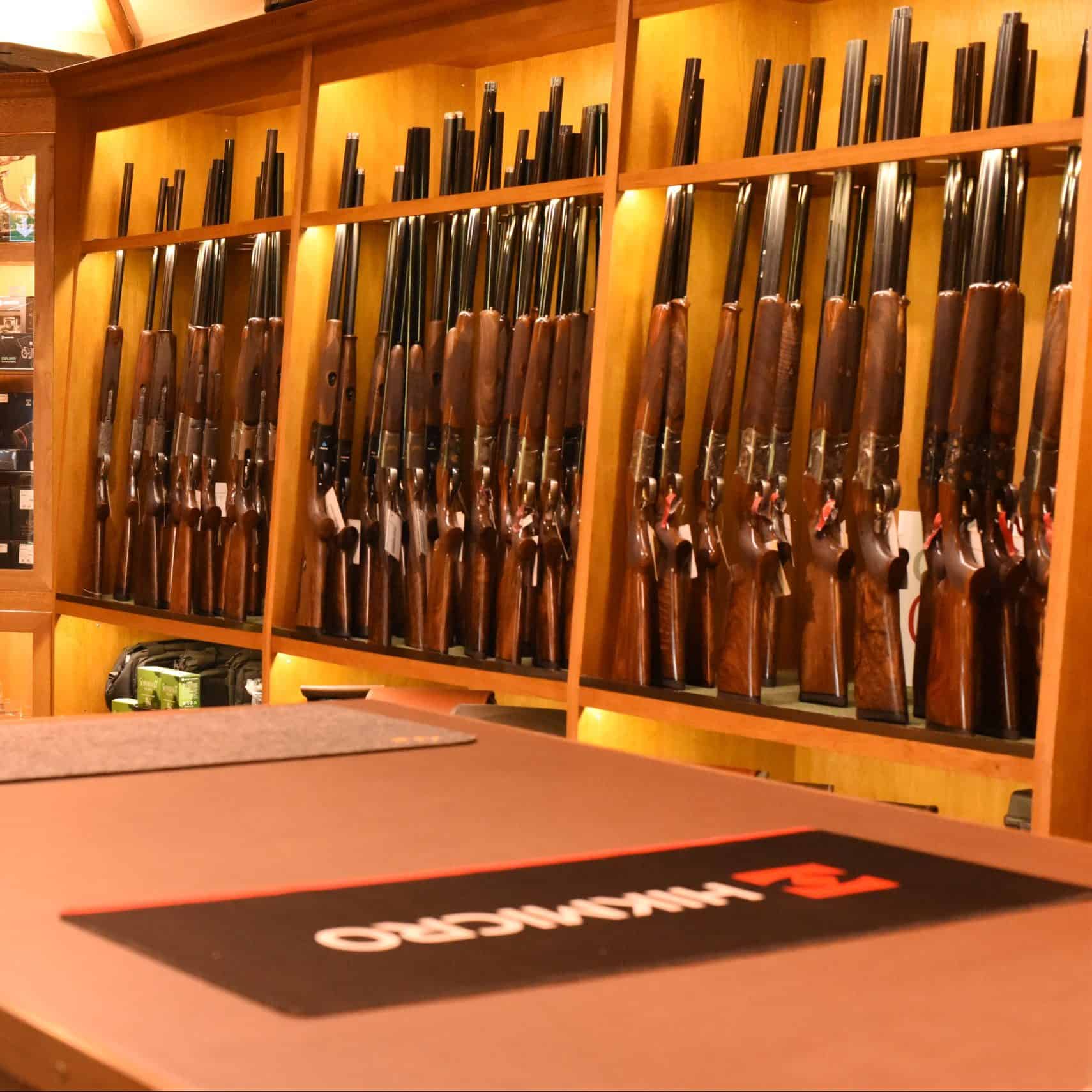 Range of shotguns displayed in gun shop